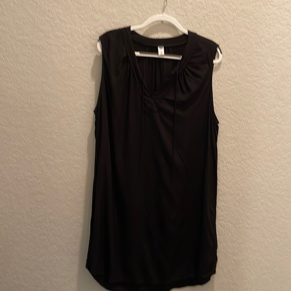 Sleeveless Black knee length dress.